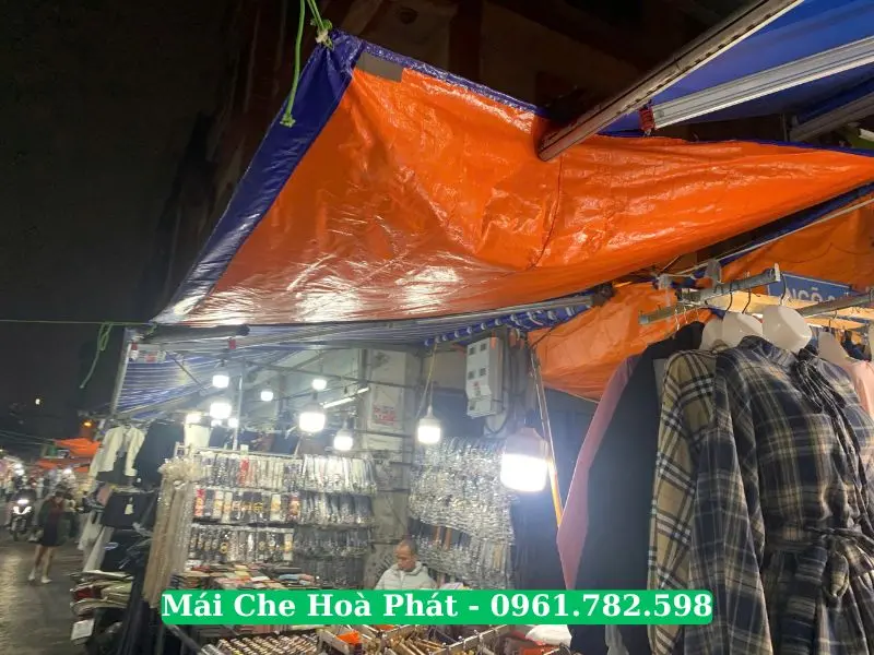 Bạt xanh cam che cửa hàng