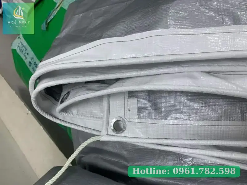 May viền đóng khoen bạt trắng xám